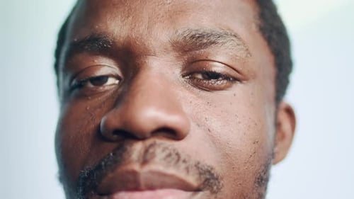 Close Up Portrait of Black Man with Goatee in Flashing Lights
