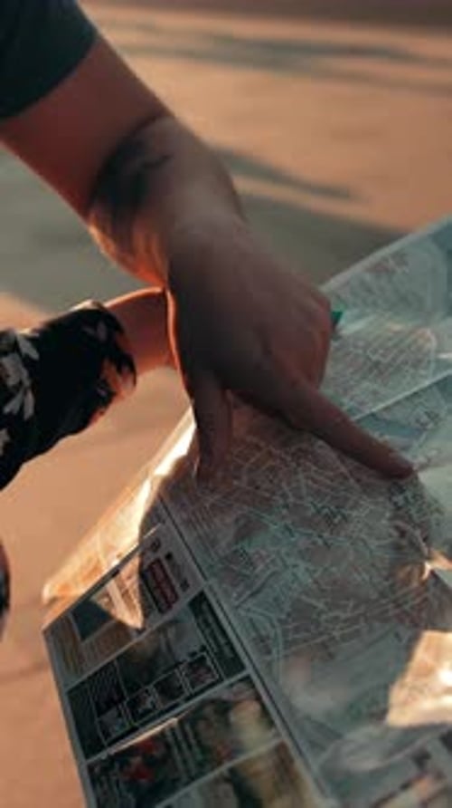 Vertical of Two People Couple Young Girl and Guy Reading City Map Outdoor
