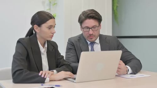 Office Colleagues Working Together on Project