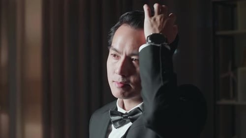 Close Up Of Asian Man In Jacket And White Classic Shirt Setting Hairstyle Before Wearing A Glasses