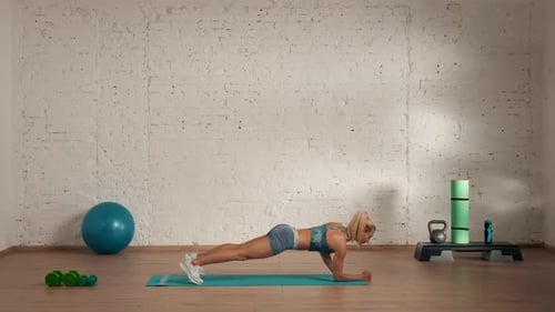 Athletic Woman Doing Plank Exercise for Core Strength