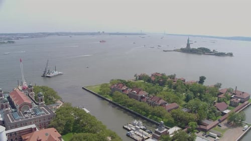 Aerial Drone Shot of Statue of Libery and Ellis Island in New York Harbor