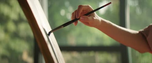 Close Up Macro Shot of Woman Artist Painter Painting on Canvas Holds Brush and Oil Colors with