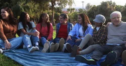 Group of Multigenerational People Enjoy Day at City Park - Multiracial Friends