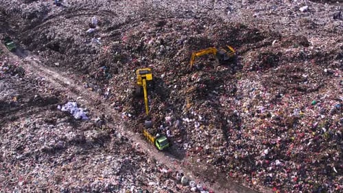 Aerial View of a Landfill Site with Heavy Machinery