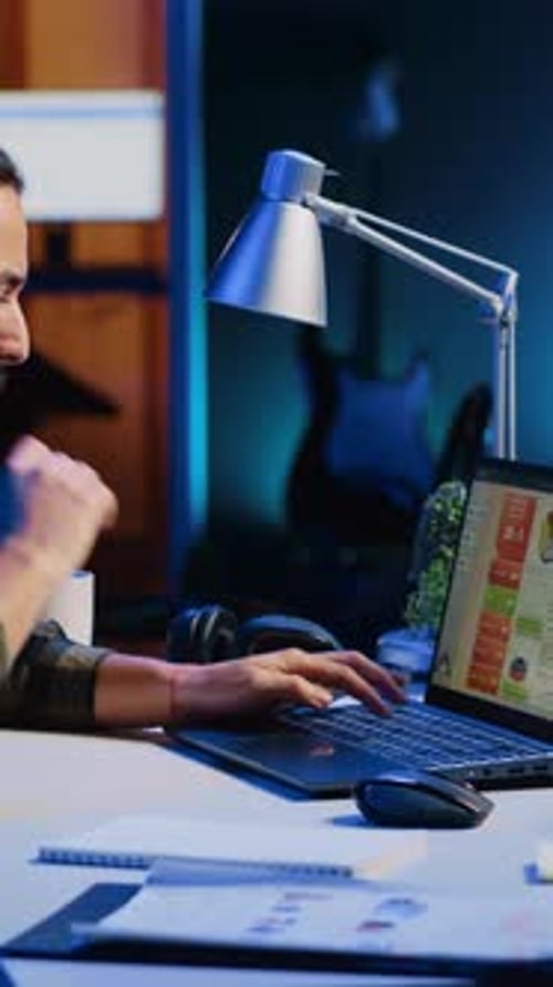 Vertical Video Man Concerned About Statistical Data Financial Graphs on Laptop Screen