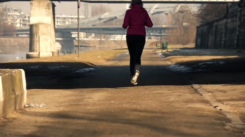 Young Woman Jogging in City Near River, Super 240