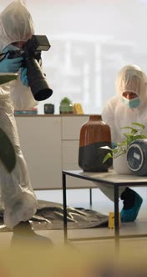 Investigators Photographing Crime Scene Evidence