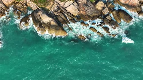 Waves crushing on rocks on the beach.