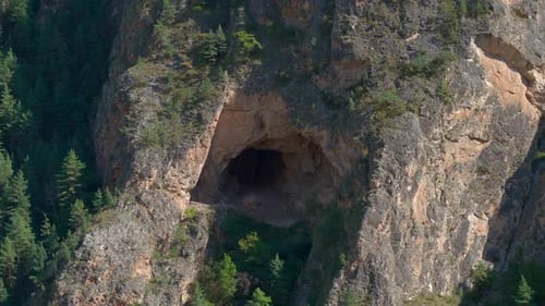 Drone Captures Cliffs Majestic Cave And Forest Scene Panoramic Shot Of Natural Rock Formation