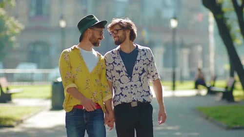 Close Up Two Gay Men Walking Look to Each Other in Eyes Holding Hands Homosexual Couple Dating LGBT