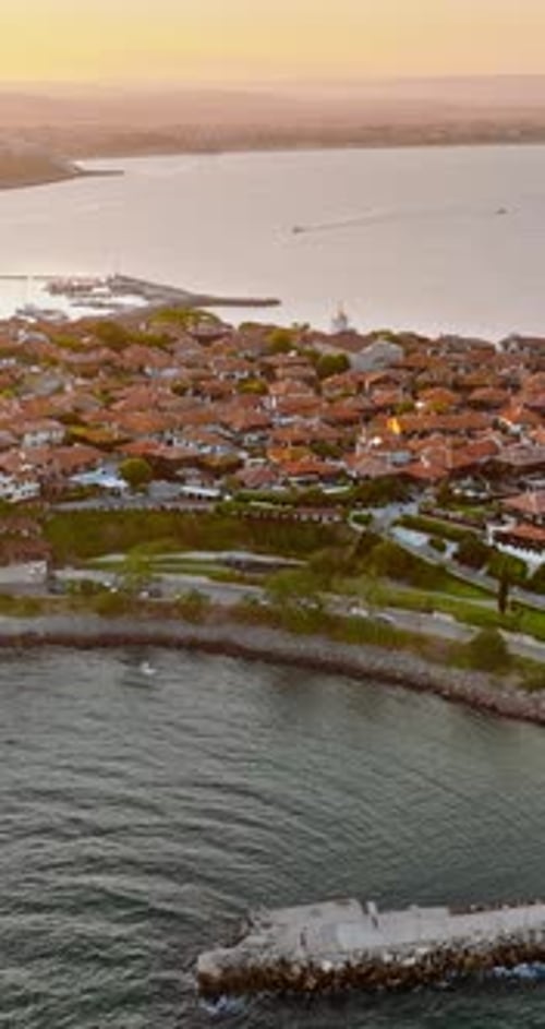 Aerial drone view of the old town Nessebar, Bulgaria at sunset. Vertical