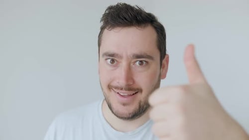 Enthusiastic Man Gives Thumbs Up Close Up