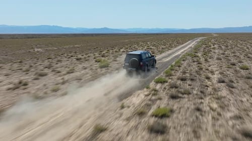 Road Trip On Remote Land Near Charyn Canyon National Park In Kazakhstan. Aerial Shot