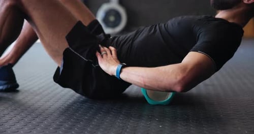 Foam roller, man and person in gym for muscle recovery, stretching and body tension or pain relief