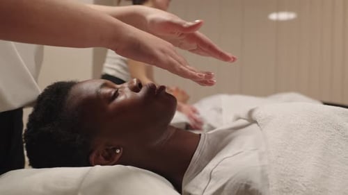 Black Woman Receiving Relaxing Reiki Energy Healing Session