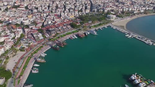 Aerial Video of a Historic Port With Old Ships Cobblestone Docks and Scenic Waterfront Buildings