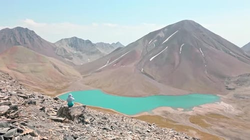 Tourist Hiker Take Pictue Of Alpine Kelitsadi Lake In Georgia