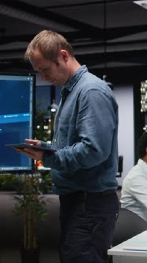 Vertical Video Manager in Office Analyzes Machine Learning Algorithms Built By Workers