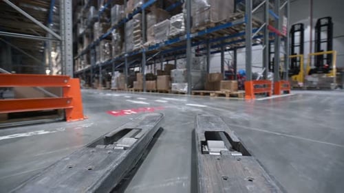 Vehicle Trucks Move at Large Rows Between Shelf with Cardboard Boxes, Products,