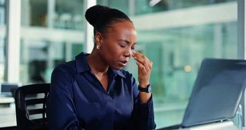 Tired, black woman or headache with laptop for stress, anxiety or mental health in office
