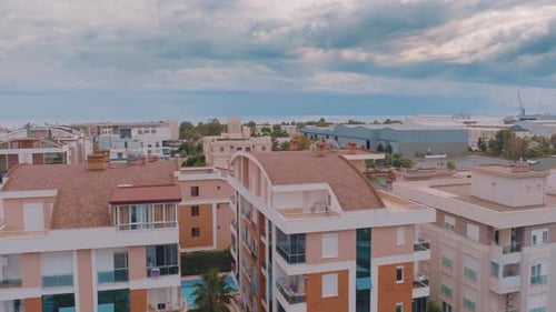 Flight Over the Resort Town on the Background of the Sea
