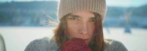 A Winter Portrait of a Young Woman Captured in a Beautiful and Scenic Snowy Landscape