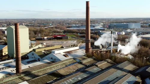 Pilkington glass factory warehouse buildings aerial descending view industrial facility rooftop