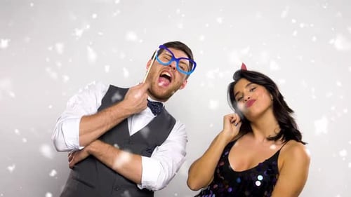Celebration, Fun And Holidays Concept - Happy Couple Posing With Party Props At Christmas Or New ...