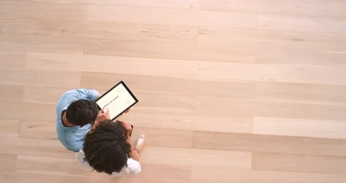 Coworkers Collaborating, Looking at Tablet Data