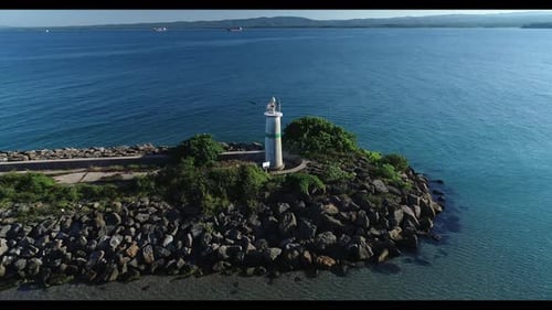 Lighthouse at The End Of The Harbor