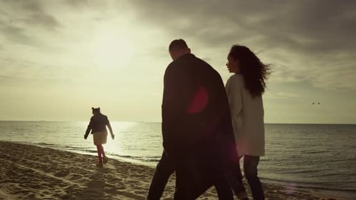 Calm People Enjoy Holiday at Sunset Sea Beach. Unknown Family Loving Nature