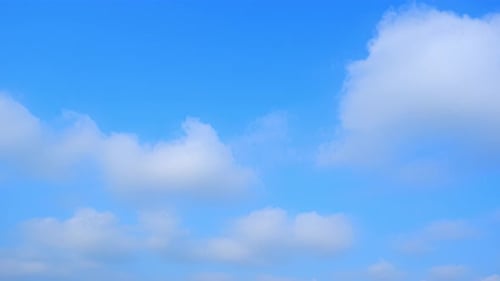 White Clouds Drifting in Blue Sky Time-Lapse