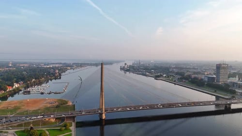 Aerial View of the Daugava River and Vansu Bridge in Riga Early in the Morning at Dawn on a Clear