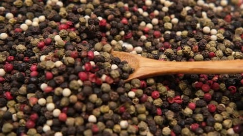 Close up of Colorful Peppercorns with Wooden Spoon