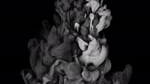 Abstract Light Gray Ink Swirls on Black Background