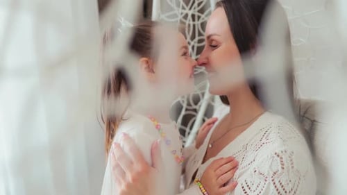 Loving Mother and Daughter Embrace Indoor, Portrait