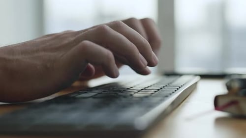 Working Business Man Typing On Computer Keyboard In Office Close-Up. Person Hands Writing Email O...