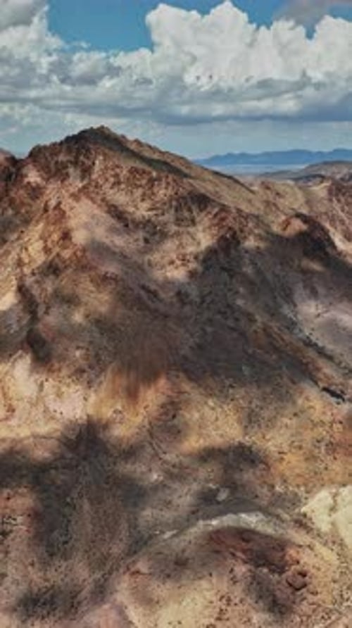 Aerial view of Nevada mountains showcasing rugged terrain and shadows