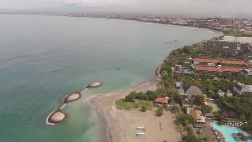 Drone Aerial View Panning Left Over Kuta, Bali – Showcasing Luxury Resorts and Residential Propertie