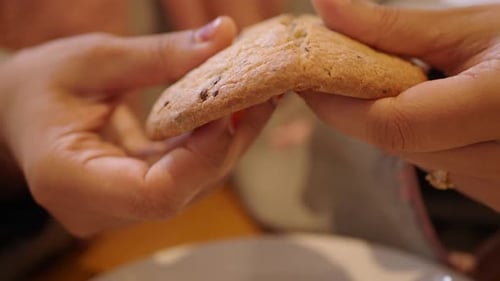 Breaking Chocolate Chip Cookie in Half Close Up