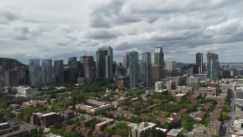 Aerial view, drone approaching downtown Montreal, skyline, cityscape, buildings, skyscrapers, towers