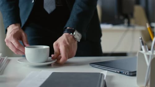 Working on Laptop with Cup of Coffee