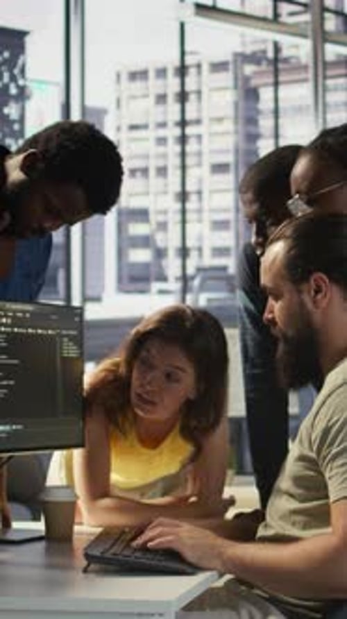 Vertical Video Team of Developers Doing Brainstorming Optimizing Code