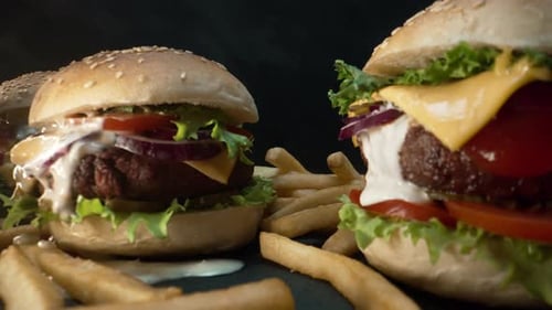 Big Homemade Appetizing Burgers with Toasted Buns Macro Slider Shot Served with Crispy French Fries