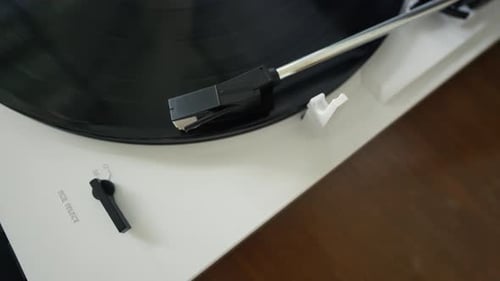 Vinyl record player needle on a record.
