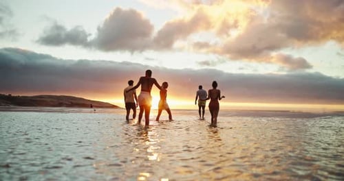 Water, relax and friends on beach at sunset for holiday, vacation and weekend together