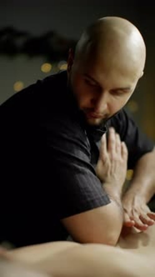 Man Giving Back Massage for Muscle Relief