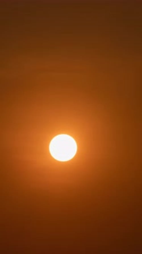 Sun Rising or Setting in an Orange Sky