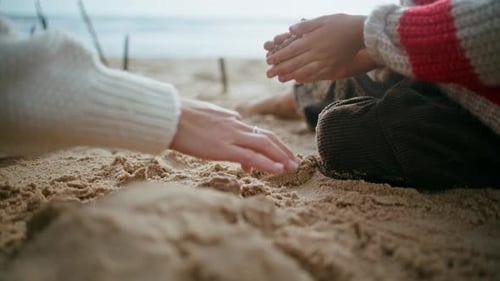 Closeup Boy Playing Sand on Ocean Shore Focused Child Hands Building Castle